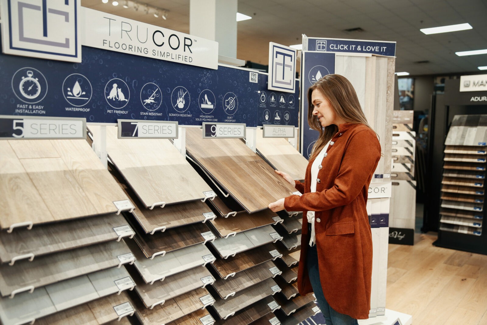 Woman checking flooring products | Carpets Of Dalton